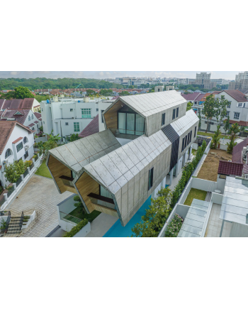 Innovative Singapore home featuring bold cantilevered concrete volumes, modern forms, and efficient use of a narrow urban plot.